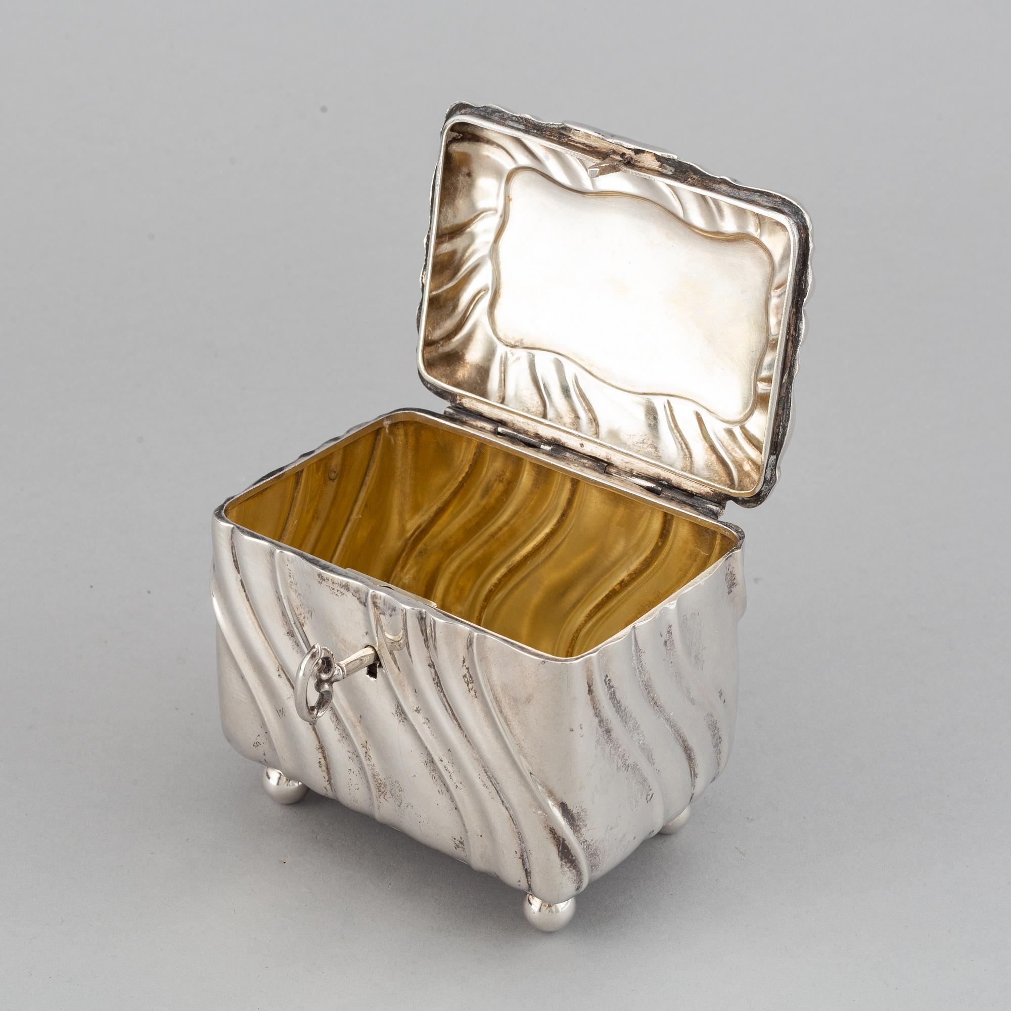A 20th century parcel-gilt silver sugar-box, Swedish import marks from 1919.