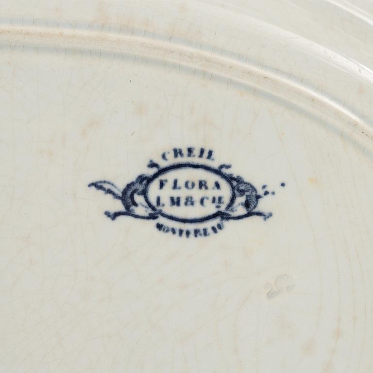 A 42 piece earthenware dinner service, 'Flora', Creil Montereau, France, late 19th Century.