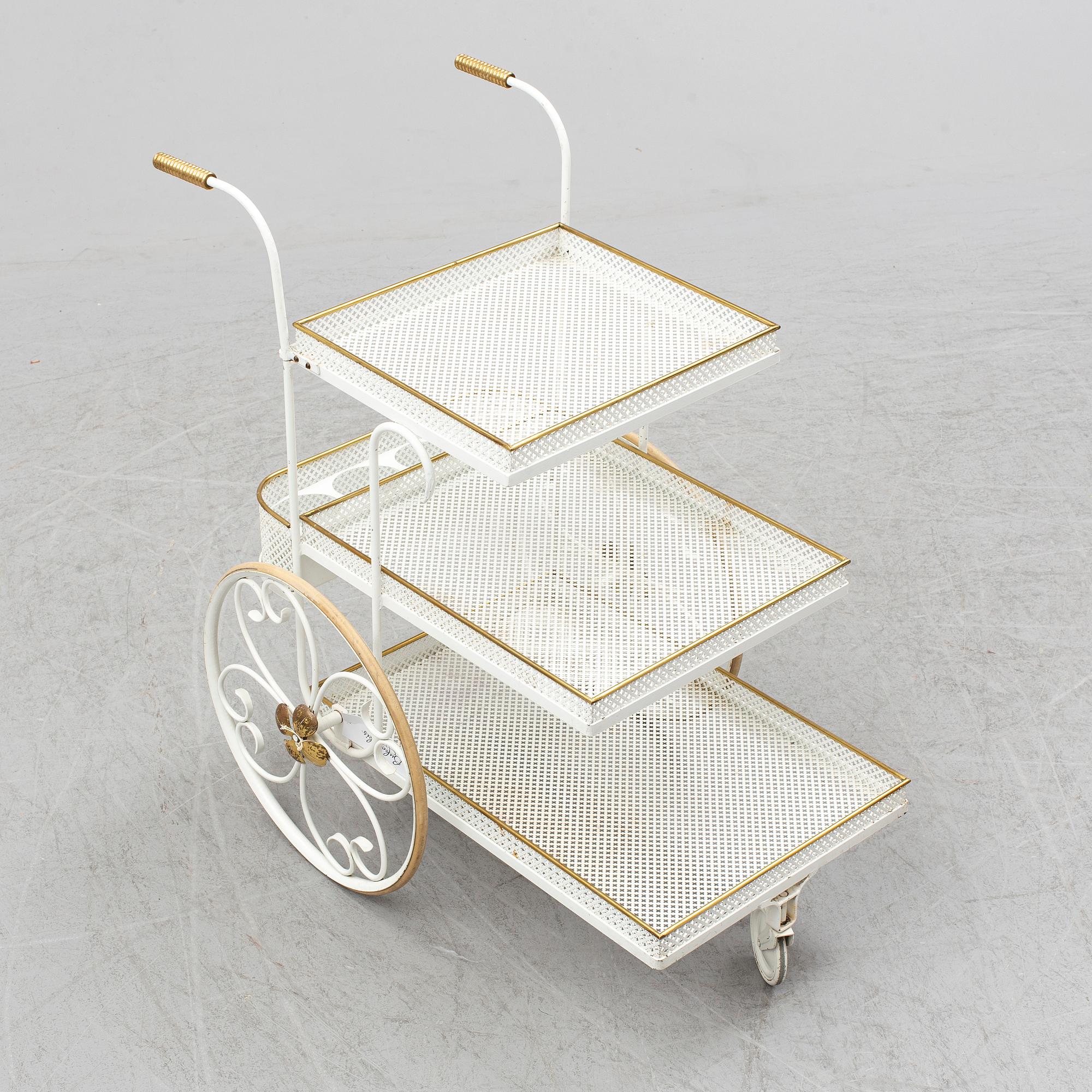 A white lacquered metal and brass serving trolley, 1940's-50's.