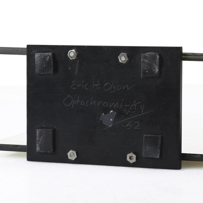 ERIC H OLSON, Optochromi, glas och plexiglas, undertill signerad Eric H. Olson och daterad AG -62.