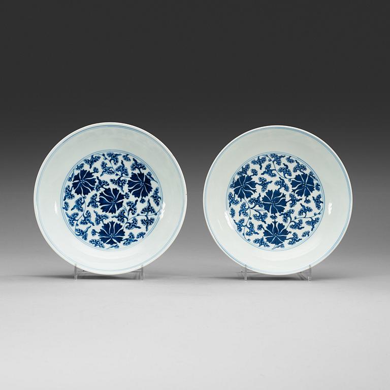 A pair of blue and white lotus dishes, Qing dynasty with Qianlong seal mark.