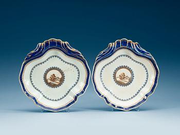 A pair of "European subject" blue and white, and gold dishes, Qing dynasty, Jiaqing (1796-1820).
