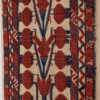 A TENT BAND, FRAGMENT, an antique Turkmen, Czar Russia, ca 102,5 x 39 cm. Framed (with the mounting 107x42 cm).