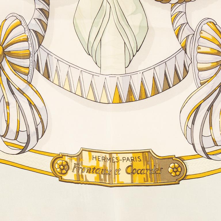 Hermès, a 'Frontaux et Cocardes' silk scarf.