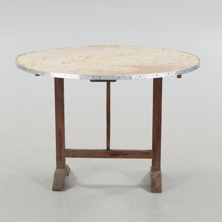 A folding table, a so called wine testing table from the early 20th century.
