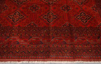 An Afghan carpet, 343 x 243 cm.