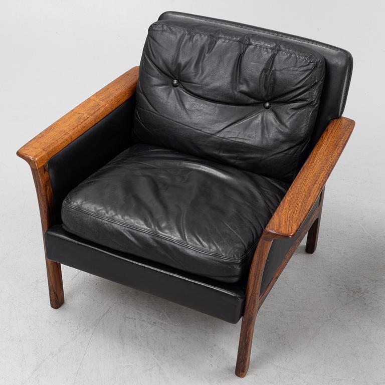 A pair of leather and rosewood easy chairs,  Bröderna Andersson, Ekenässjön, Sweden 1960s.