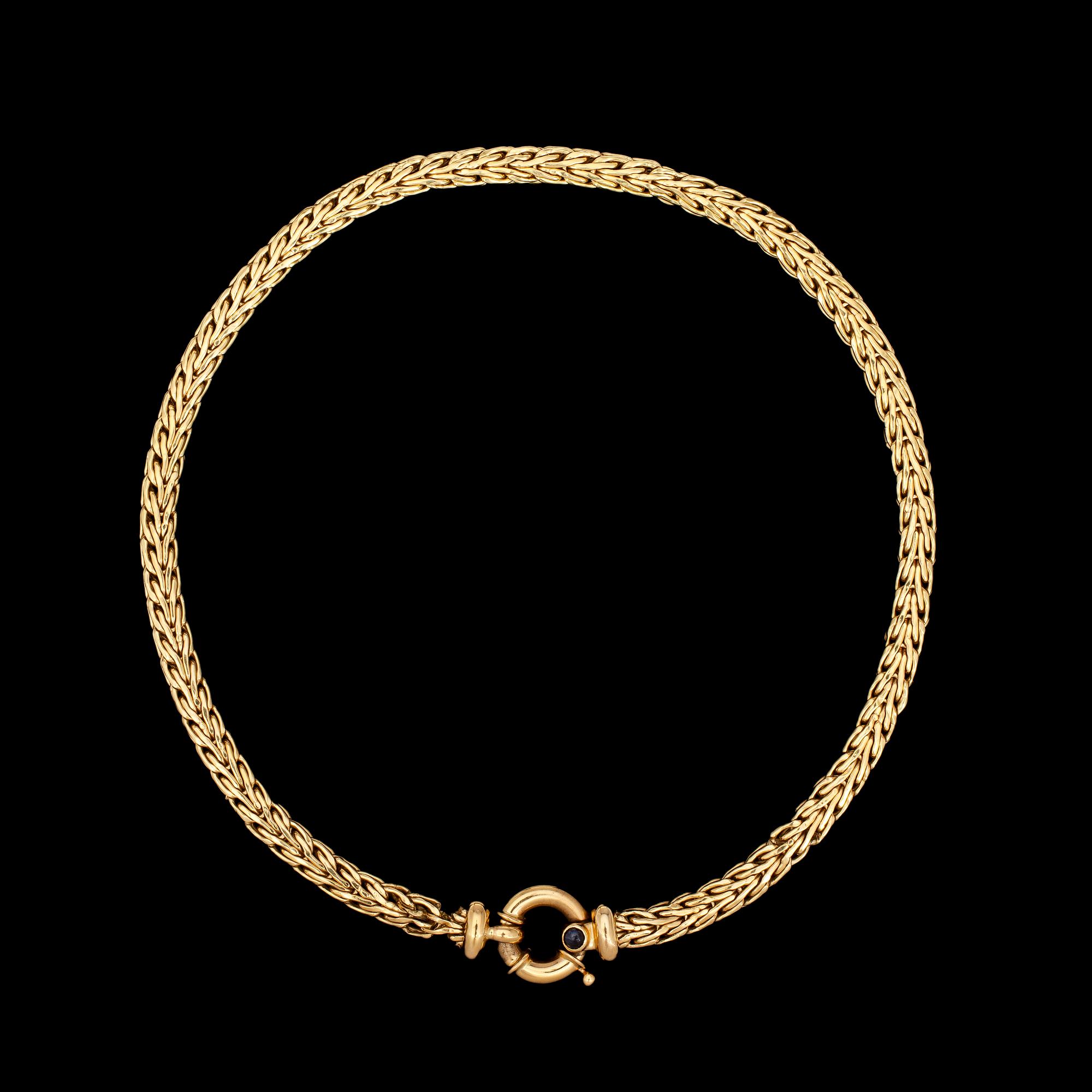 NECKLACE, gold with cabochon cut blue sapphire, Italy.