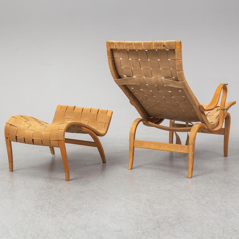 An mid 20th Century easy chair  and stool by Bruno Mathsson for Karl Mathsson Värnamo.