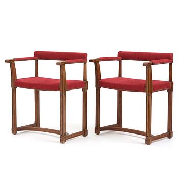 247. Carl Bergsten, a pair of oak easy chairs, Nordiska Kompaniet, 1923, ordered for the 1923 Jubilee Exhibition in Gothenburg.