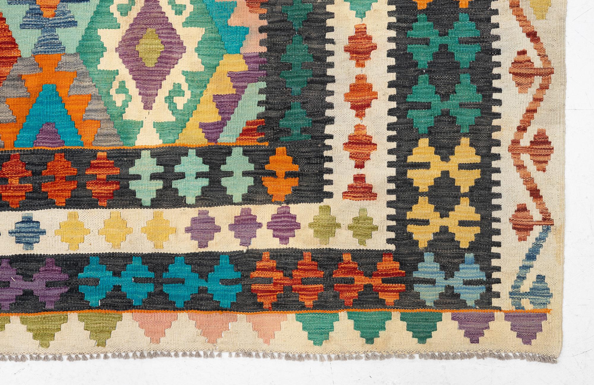 An, Afghan kilim carpet, c. 496 x 319 cm.