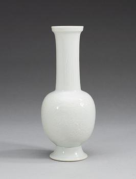 A white glazed vase, Qing dynasty with mark.