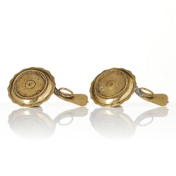 A pair of rococo brass candlesticks possibly by C. Liendenberg (active in Stockholm from 1745).