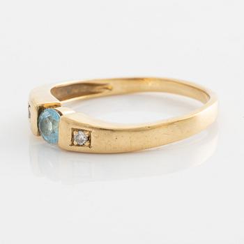 Ring, gold with topaz and two small brilliant-cut diamonds.