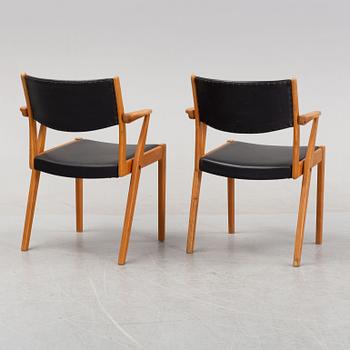 A pair of 1950's/60's armchairs.