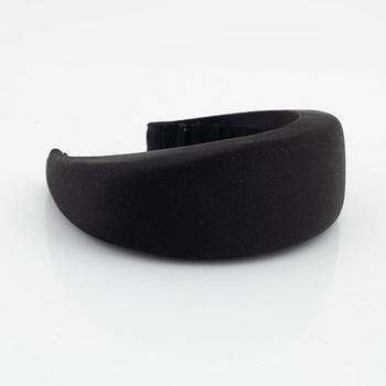 Prada, a black silk hair accessory.