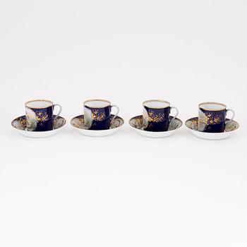 A set of four Russian cups with stands, Kuznetsov (1891-1917).