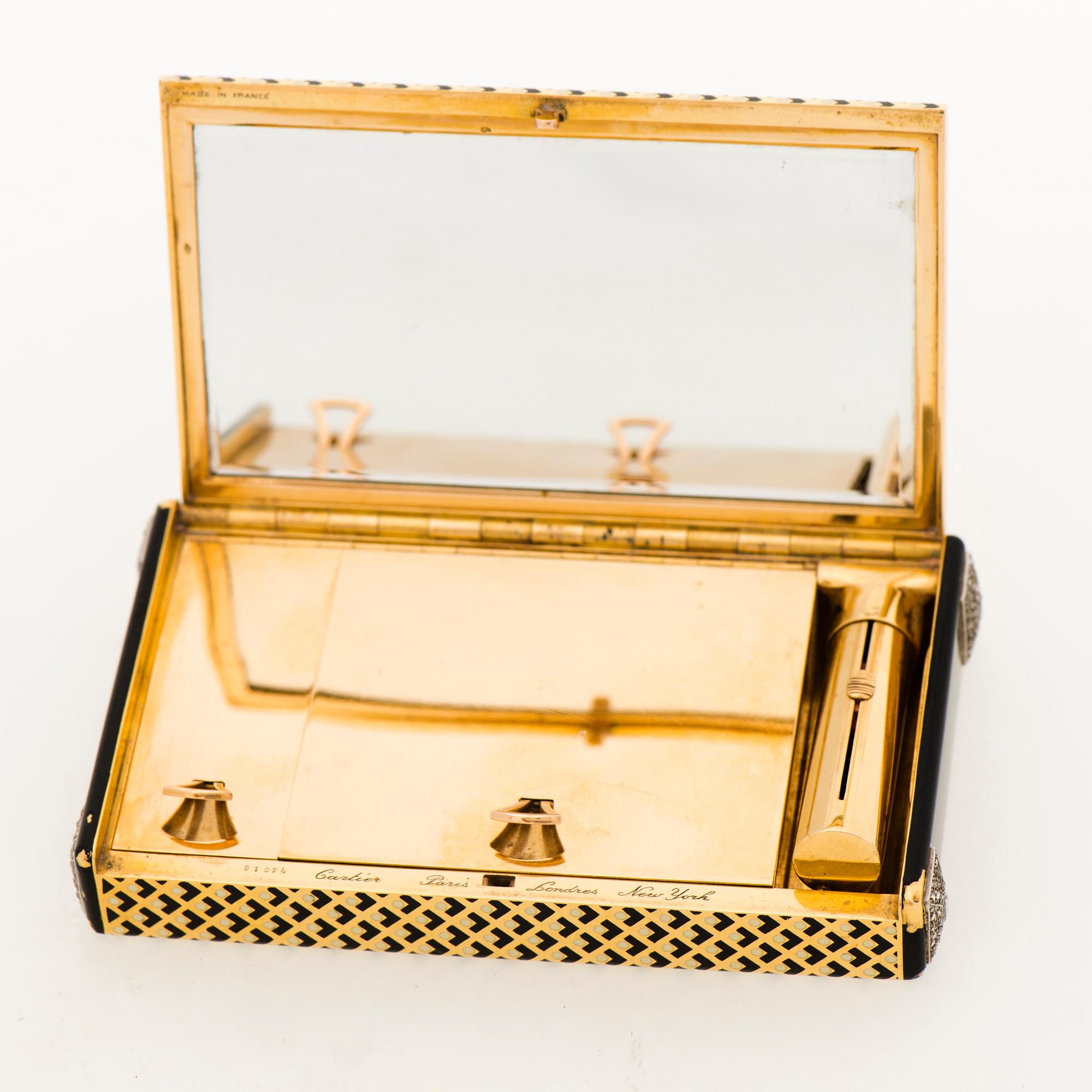 Cartier Art Deco Vanity Case 18K guld med svart emalj och baguette- och rosenslipade diamanter.