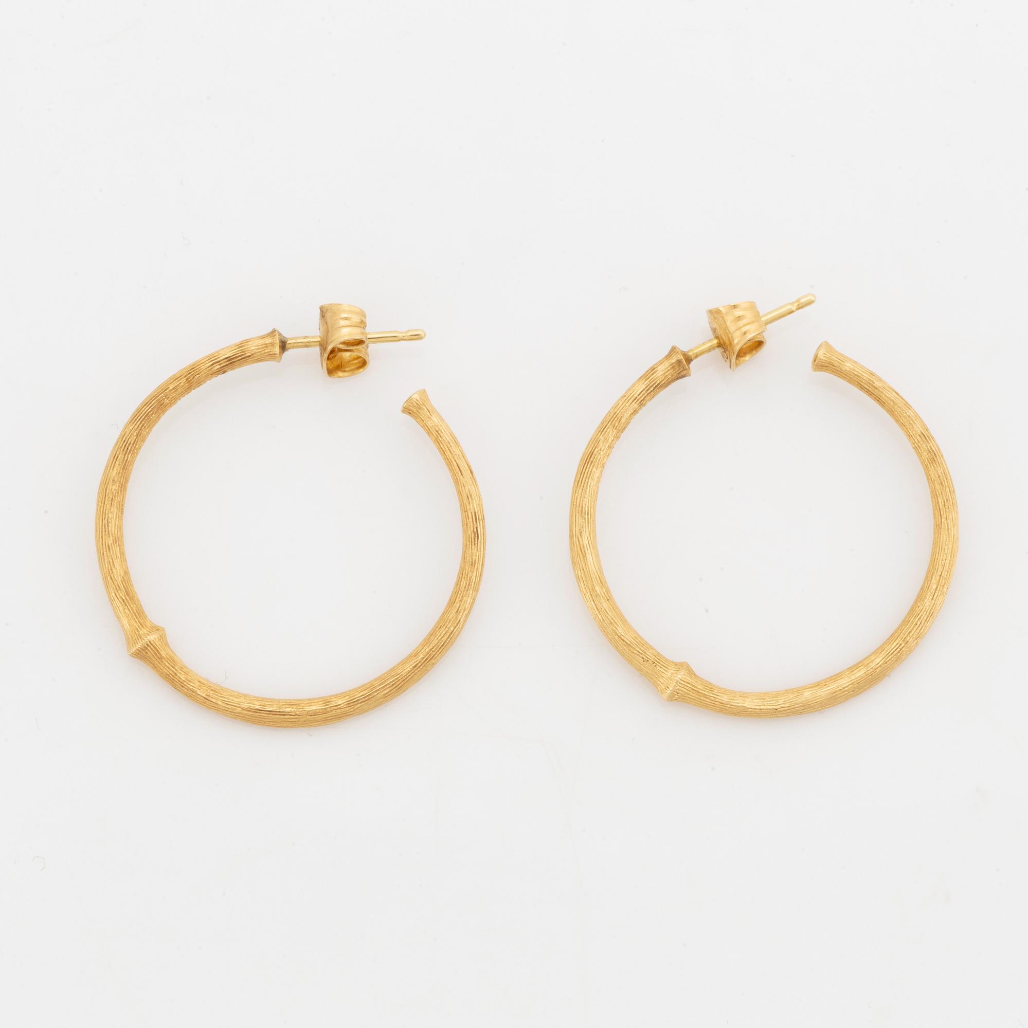 Ole Lynggaard, 18K gold earrings.
