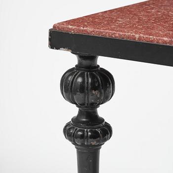 A table with granite stone top from Älvdalen, first part 19th century on a later metal stand.