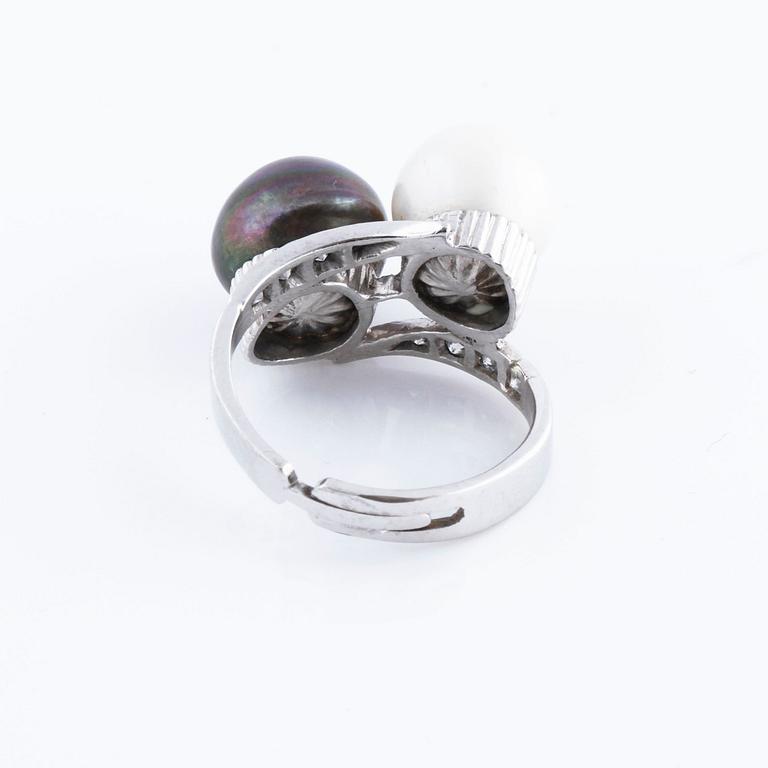 A cultured pearl and single cut diamond ring.