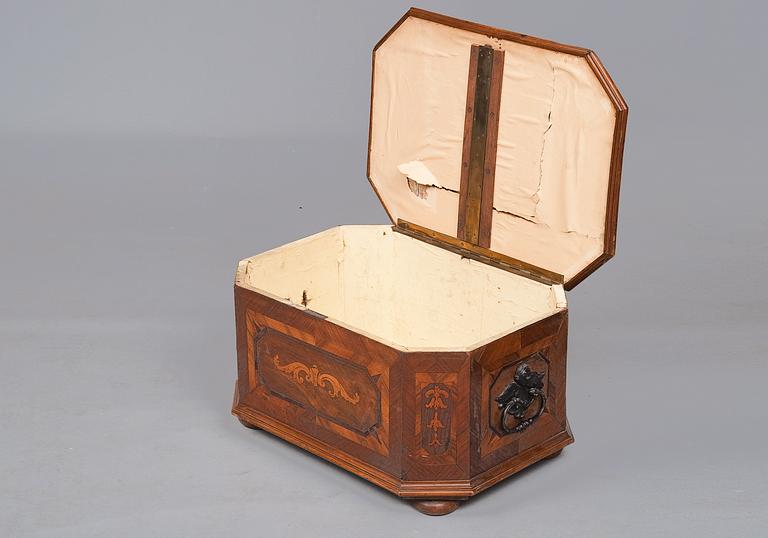 A WOODEN CHEST.