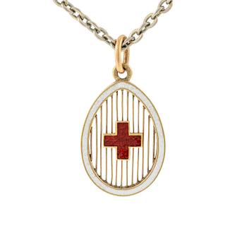 512A. An enamel gold Red cross pendant by Fabergé.