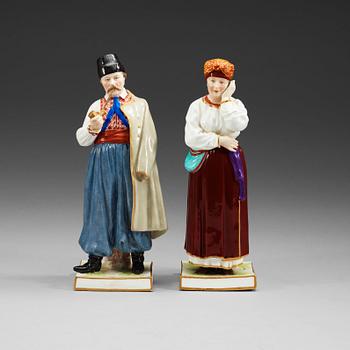 Two Russian figures of peasants, Popov, 19th Century.