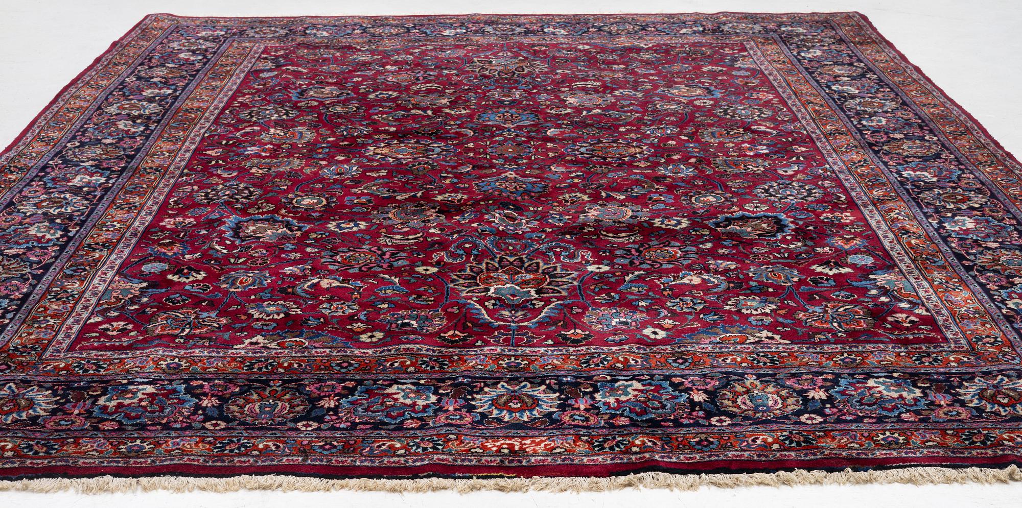 A Meshed carpet, c. 393 x 305 cm.