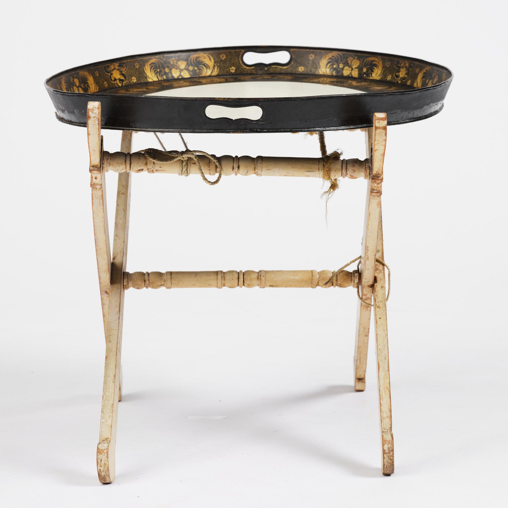 A tole-peinte Empire tray, first part 19th century on a later stand.