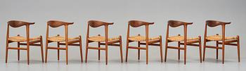 Hans J. Wegner, a set of six teak and rattan "Cowhorn Chairs" "JH-505", executed by cabinetmaker Johannes Hansen, Denmark 1950-60's.