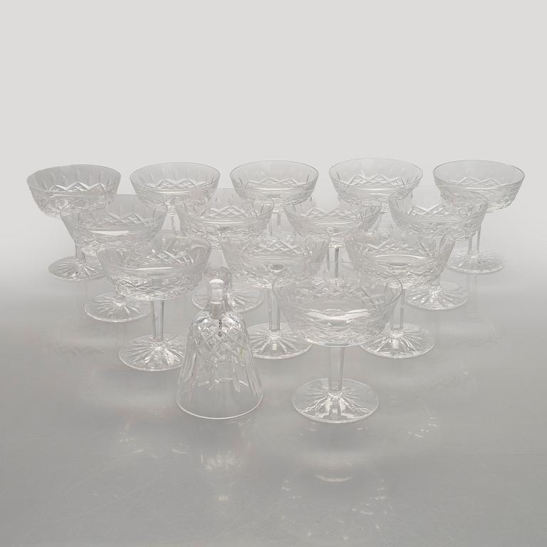 A set of 13 dessert bowls / champagne glasses, Waterford. and a table clock.