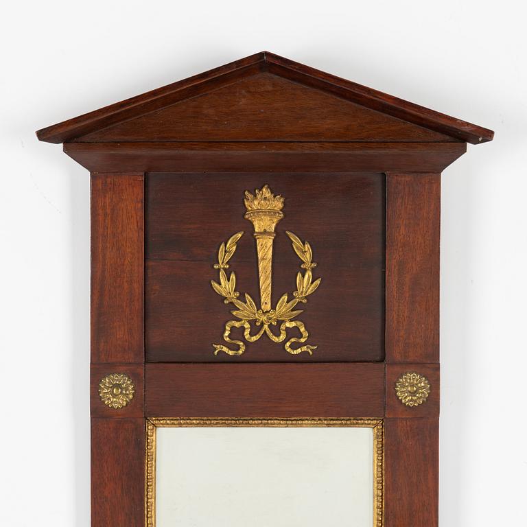 An Empire style mirror, circa 1900.
