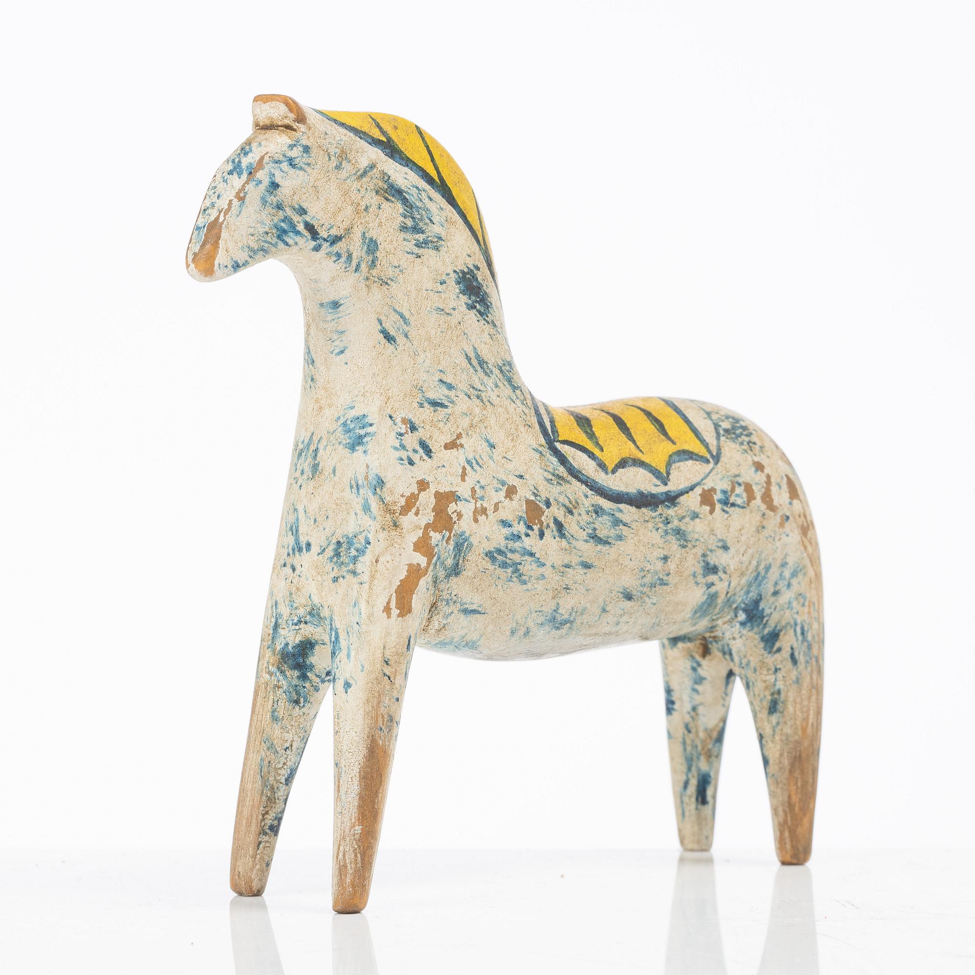 A carved and polychrome painted Dalecarlian horse, circa 1900.