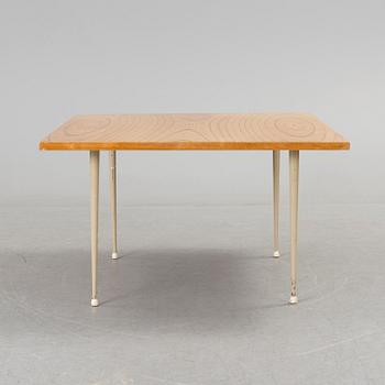 A coffee table marked Tapio Wirkkala, Asko, Made in Finland.