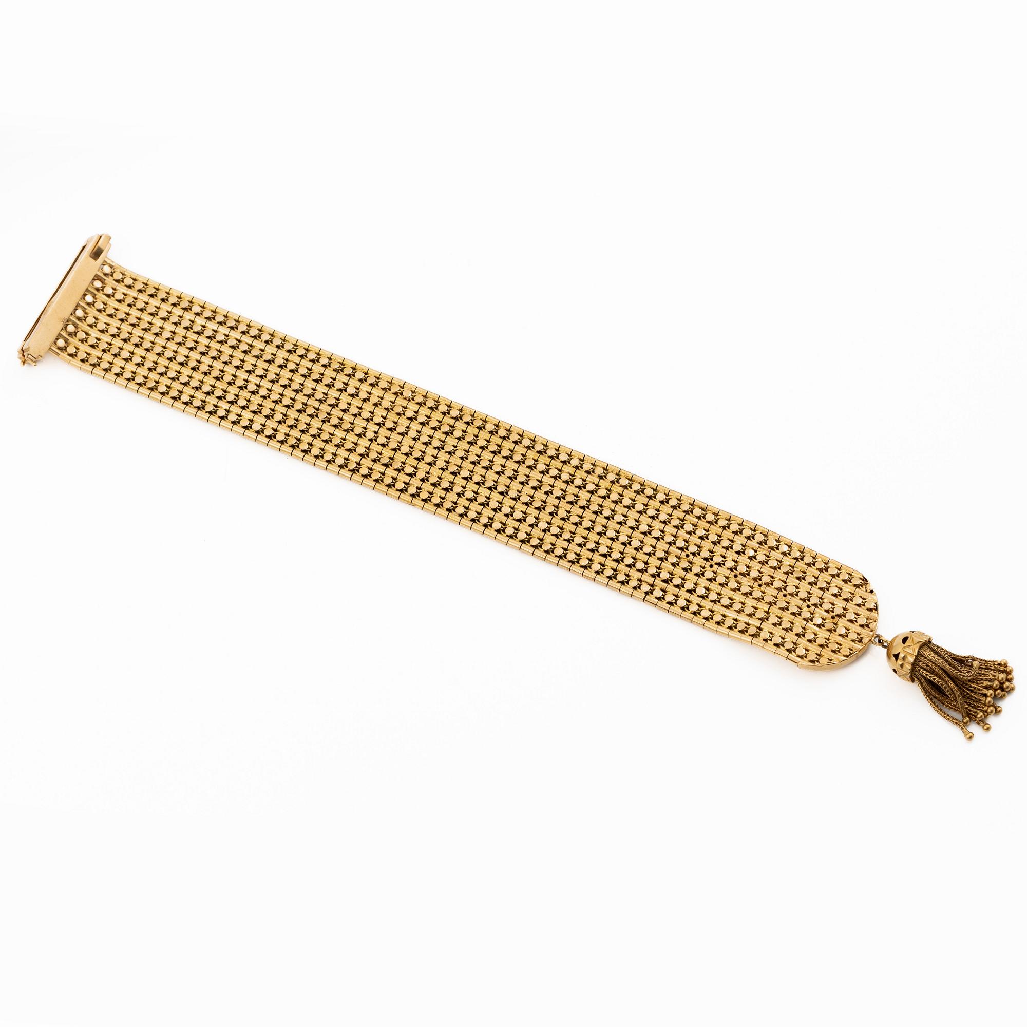 Armband 18K guld med tofs, 1900-talets andra hälft.