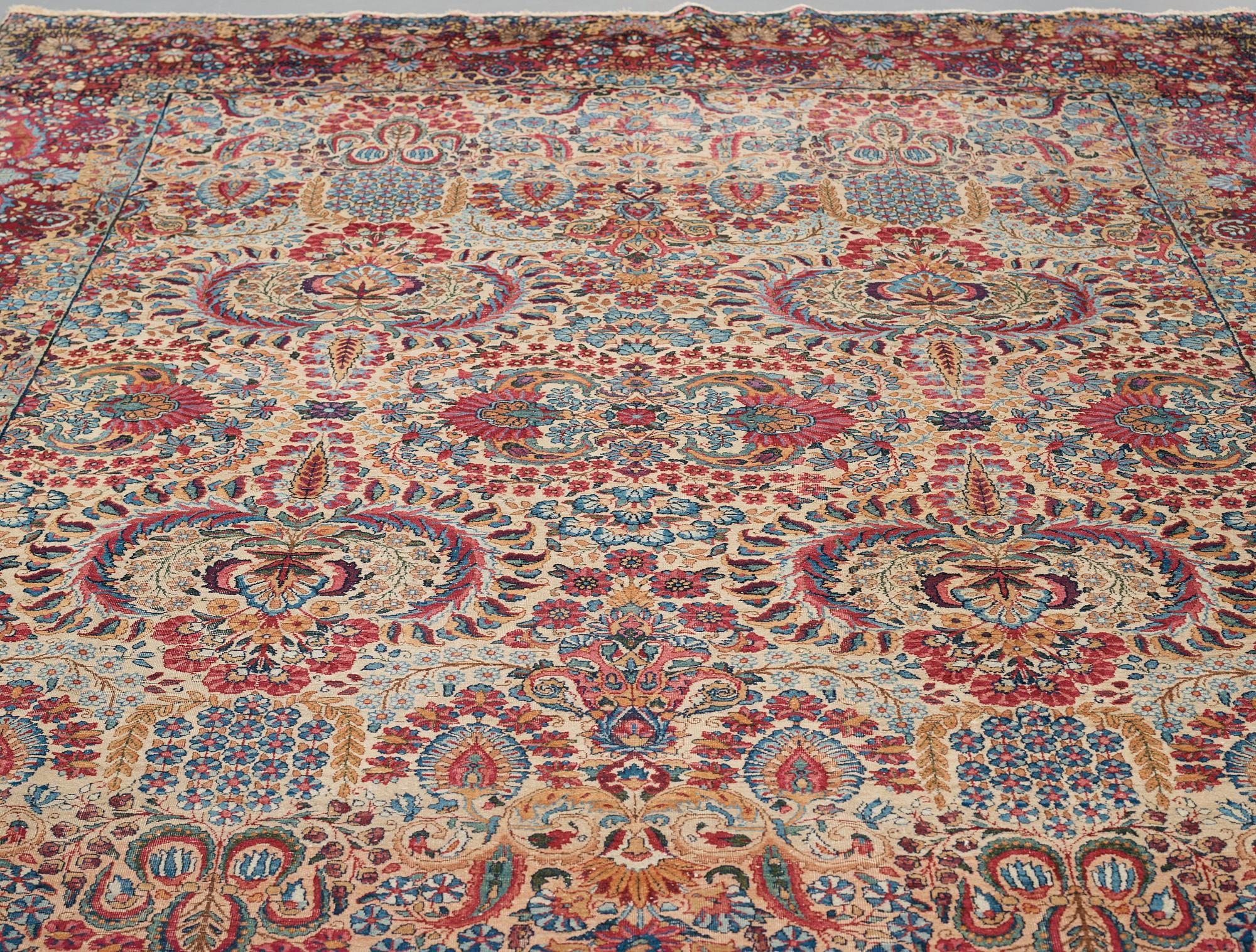 A carpet, a semi-antique Kerman, ca 375-379,5 x 268-271 cm.