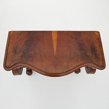 A Swedish Empire mirror with a console table, first half of the 19th Century.