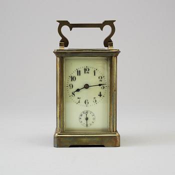 An early 20th century brass and glass carriage clock.