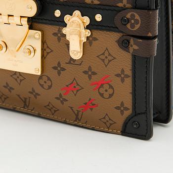 Louis Vuitton, a "Reverse Monogram Trunk Clutch" bag.