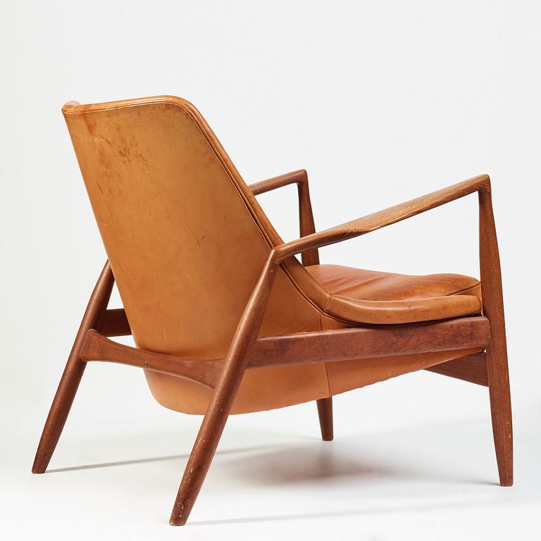 Ib Kofod-Larsen, a "Seal" teak and brown leather armchair, Olof Persson Möbler, Jönköping, Sweden 1950-60's.