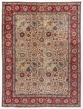 A Tabriz carpet, c. 385 x 287 cm.