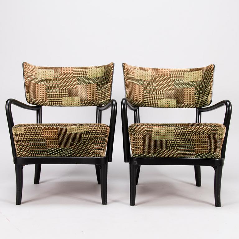 A mid-20th Century pair of armchairs.