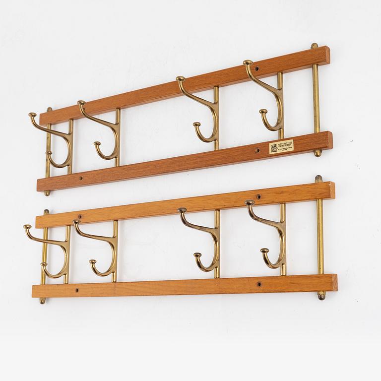 A pair of 'Dekorativ' coat hangers, Skoglunds metallgjuteri, Anderstorp, mid 20th Century.