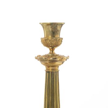 A pair of French Empire candlesticks, early 19th century.