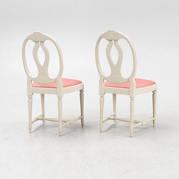 A Gustavian style table with four chairs, second half of the 20th century.