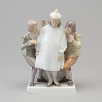 A Royal Copenhagen porcelain figure group, 'Emperors new clothes', Denmark, 1920s.