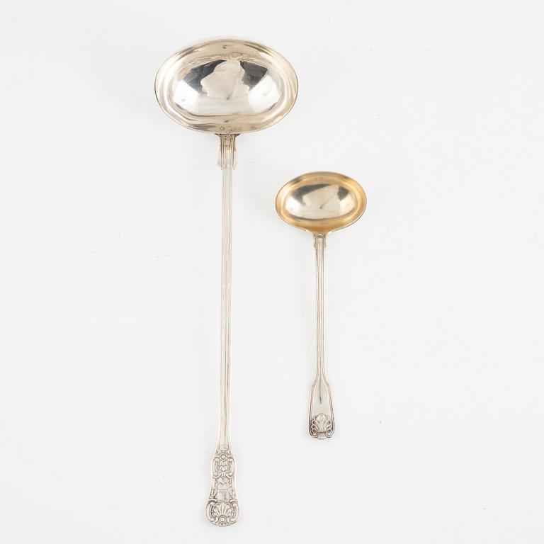 Two Swedish 19th century soup ladles, the small in silver, mark of Gustaf Möllenborg and the large in silver plate.