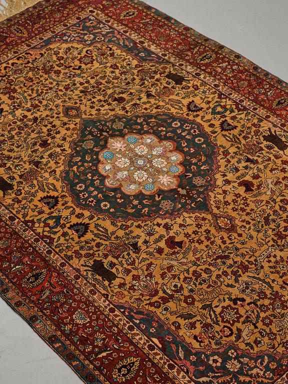 A rug, a semi-antique silk Turkish with metal brocade, ca 194-195 x 127,5-132,5 cm.