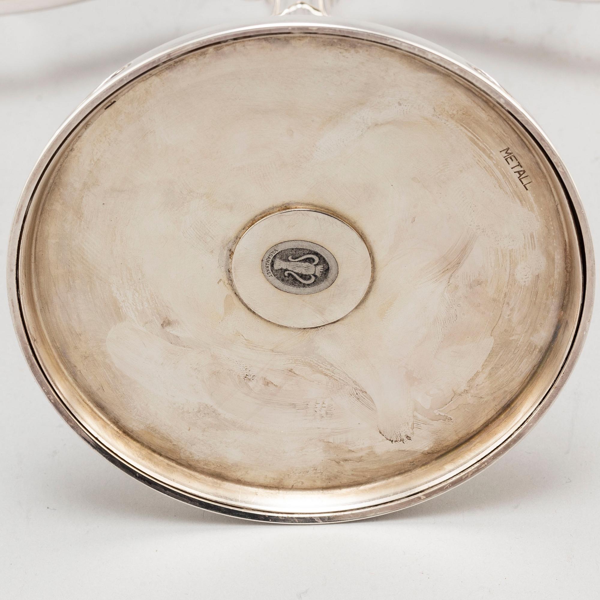 A pair of Swedish silver candelabra, makers mark GAB, Stockholm 1935 and 1938.